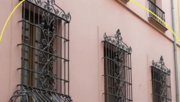 The hidden reason these curved window bars exist in every city The hidden reason these curved window bars exist in every city