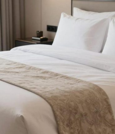 Hotels: here is what the strip of fabric placed across the bed is really for