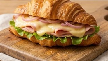 Croissant Sandwich with Melting Beaufort and Homemade Pickled Onions