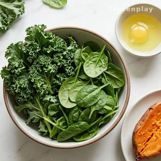 Bowl of leafy greens, egg whites and a halved sweet potato on a kitchen counter