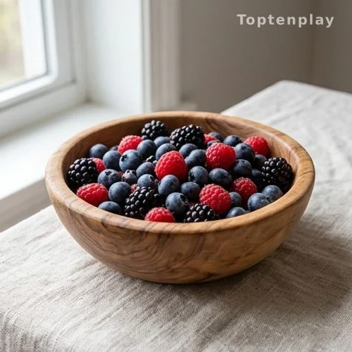 Mixed wild berries in a wooden bowl, high in antioxidants linked to cancer prevention