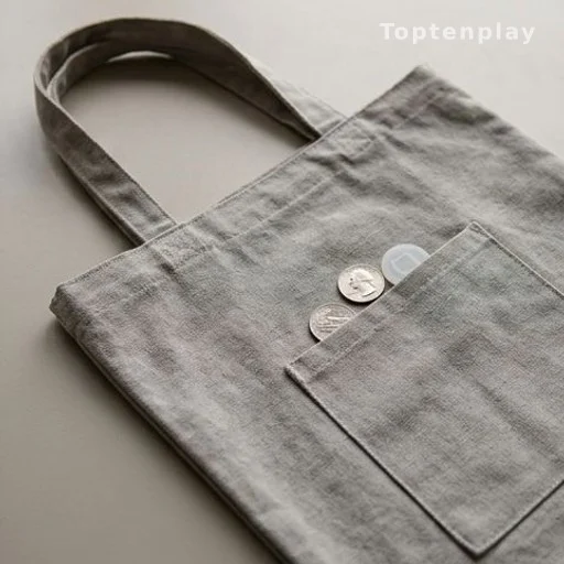 Reusable shopping bag with a quarter and cart token in a side pocket