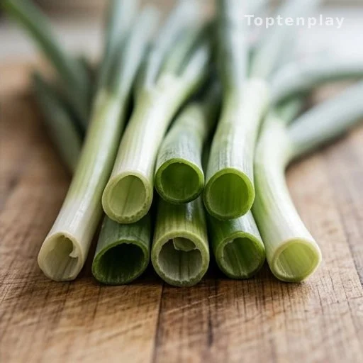 Cross-section of hollow green onion stalks on a kitchen surface