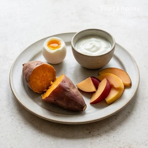 Balanced breakfast plate with sweet potato, egg, yogurt and fresh fruit