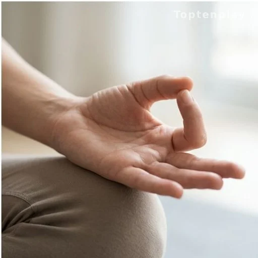 Hand forming Gyan Mudra with thumb and index finger touching, palm facing up